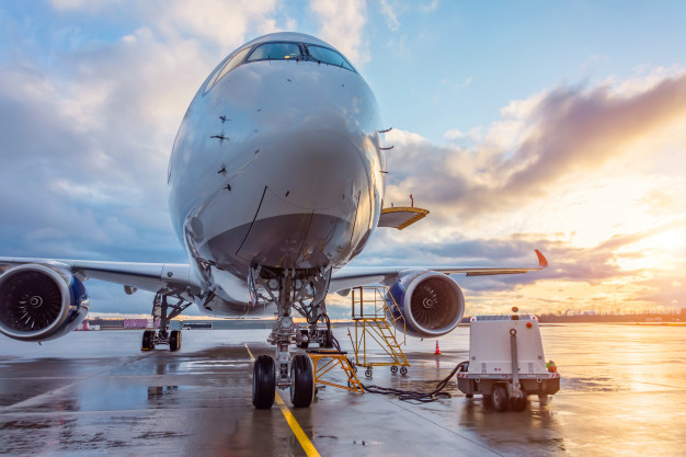 airplane-before-flight-aircraft-maintenance-airport-sunset-aerodrome_165577-131