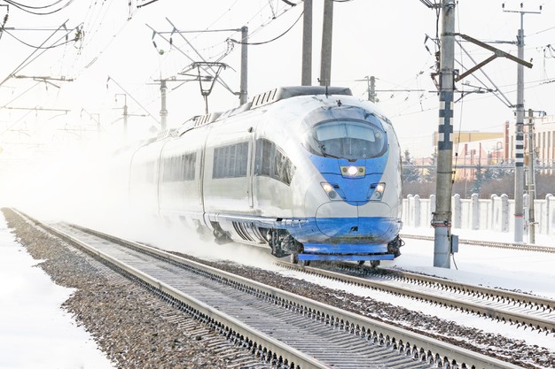 high-speed-train-rides-high-speed-winter-around-snowy-landscape_165577-495