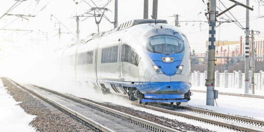 high-speed-train-rides-high-speed-winter-around-snowy-landscape_165577-495